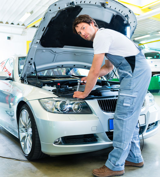 Car Mechanic Working With Tool In-Service Workshop